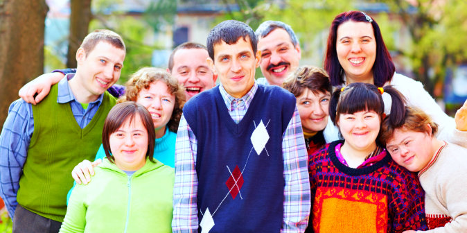 persons with disabilities standing together and smiling