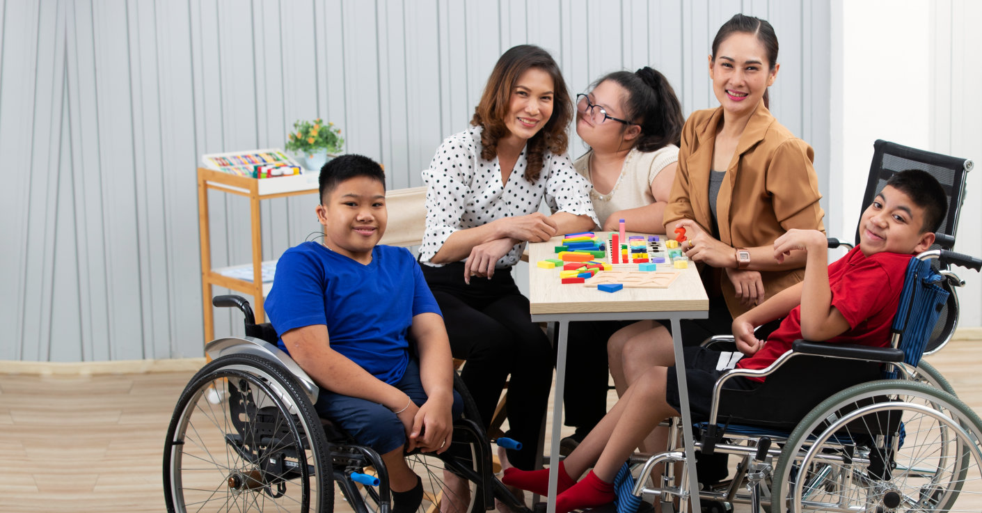 teachers together with their students with disabilities